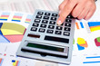Hand with a calculator.
