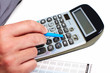 Hand of a businessman with calculator.