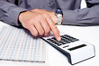 Hand of a businessman with calculator.