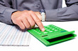 Hand of a businessman with calculator.