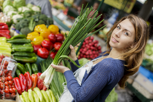 Photo: Young woman at the market Young woman at the market