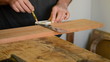 Craftsman or carpenter mark out in a table wood