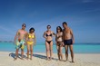 group of happy young people have fun on bach