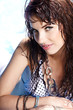 Photo: Pretty woman in white bikini floating in swimming pool Pretty woman in white bikini floating in swimming pool