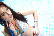 Photo: Beautiful young sexy woman by a swimming pool Beautiful young sexy woman by a swimming pool