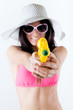 Foto: bikini girl with squirt gun looking at camera bikini girl with squirt gun looking at camera