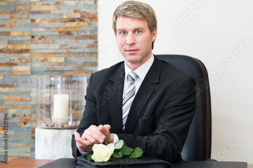Photo: Mortician in his store Mortician in his store