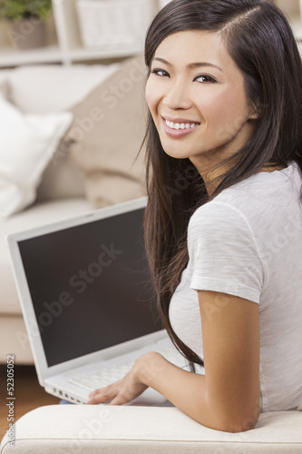 Photo: Beautiful Asian Chinese Woman Using Laptop Computer Beautiful Asian Chinese Woman Using Laptop Computer