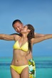 happy young  couple enjoying summer on beach