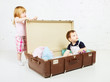Photo: Boy and Girl in Suitcase Boy and Girl in Suitcase