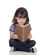 Adorable little girl with a book reading