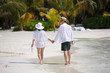 Photo: happy young couple have fun on beach happy young couple have fun on beach