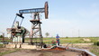 oil worker check pump jack