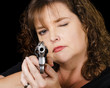 Woman holding loaded gun