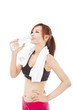 sporty young woman drinking water after workout