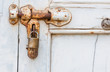 Old rusty bolts on wood door