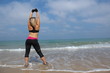 Foto: Woman Stretching On The Beach Woman Stretching On The Beach