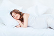 Pregnant woman asleep in bed