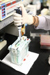 Hands are injected chemicals into the bottle.