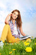 beautiful girl with book on grass