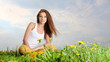 Beautiful  woman sitting outdoors and smiling