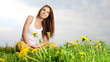 Beautiful  woman sitting outdoors and smiling
