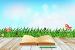 Vector: Fresh spring green grass with blue sky bokeh and open book and w Fresh spring green grass with blue sky bokeh and open book and w