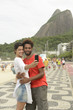 Photo: Multiethnic couple photographing themselves in Rio de Janeiro Multiethnic couple photographing themselves in Rio de Janeiro