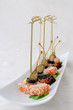Pieces of salmon in sesame with capers