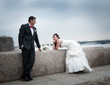 bride and groom on the banks of the river