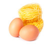Several eggs and pasta on a white