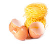 Several eggs and pasta on a white