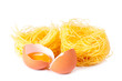 Several eggs and pasta on a white