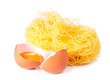 Several eggs and pasta on a white