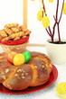 Easter sweet bread with multicolored eggs and shortbread cookies