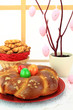 Easter sweet bread with multicolored eggs and shortbread cookies