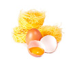 Several eggs and pasta on a white