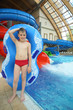 Photo: Boy with swimming toy at the water park. Boy with swimming toy at the water park.