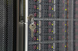 Key from server rack with multiple hard drives.