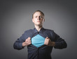 Businessman showing a superhero suit underneath his suit