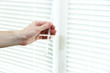 Someone opens blinds