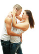 Foto: Young beautiful loving couple is embracing - on white background Young beautiful loving couple is embracing - on white background