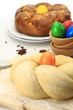 Easter sweet bread dough with multicolored eggs