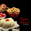 Easter sweet bread dough with red eggs on black background