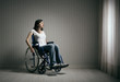 Foto: Sad woman sitting on wheelchair Sad woman sitting on wheelchair
