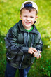 Little boy with gravel in hands