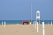 empty beach with guard tower and rescue boat in Rimini