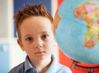 boy with africa on globe
