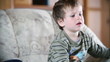 Little boy watching TV, front view