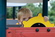 boy or kid playing  on playground.